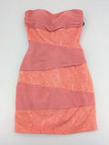 Laona pink bodycon cocktail dress with strapless design and floral lace details.