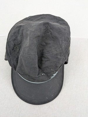 DHL green winter cap with reflective logo, ear flaps, and soft fleece lining.