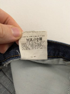 Dolce & Gabbana blue bootcut jeans with suede logo patch and classic 5-pocket design.