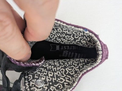 Mtng high top sneakers purple canvas with black laces and patterned white lining.