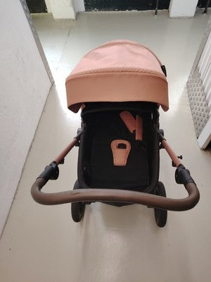 Kinderkraft pink 2-in-1 baby stroller with large wheels and elegant design.