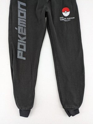 Herren grey jogging pants large Pokémon graphic print and embroidered Pokéball patch.