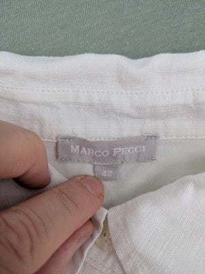 Marco Pecci white A-line dress with collar, adjustable drawstring waist, and utility pockets.