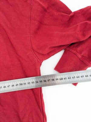 The Grinch red sweatshirt featuring large graphic of The Grinch in Santa suit