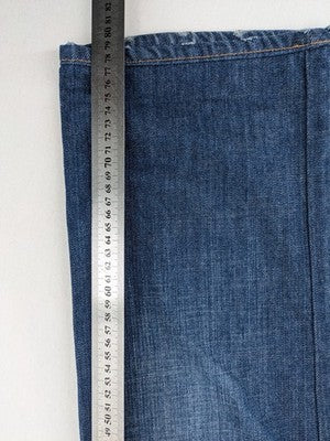 Dolce & Gabbana blue bootcut jeans with suede logo patch and classic 5-pocket design.