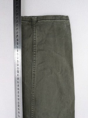 H&M khaki skinny fit jeans with classic five-pocket design and stretch cotton material.