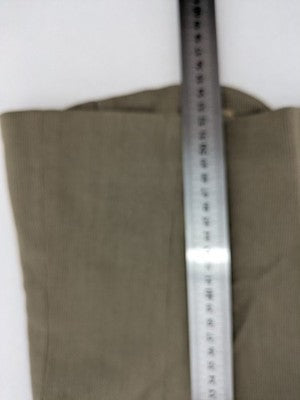Synonyme khaki vest with ribbed texture, V-neck, and three-button front.