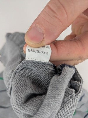 C. Comberti grey knit jumper with green and navy horizontal stripes, V-neck design.