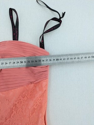 Laona pink bodycon cocktail dress with strapless design and floral lace details.