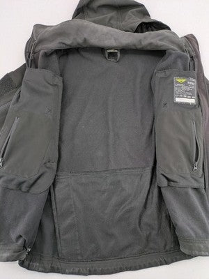 Condor grey softshell jacket with multiple pockets and adjustable hood, tactical outdoor design.
