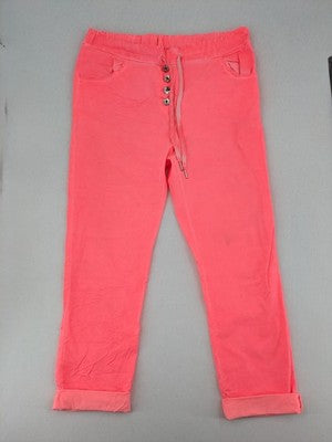 Pink Cherry pink jogpants with elastic waistband, decorative button placket, and rolled cuffs.