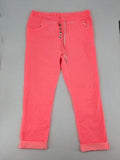 Pink Cherry pink jogpants with elastic waistband, decorative button placket, and rolled cuffs.