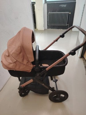 Kinderkraft pink 2-in-1 baby stroller with large wheels and elegant design.