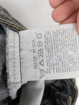 Levi's straight jeans faded black grey denim with iconic orange tab and five-pocket design.