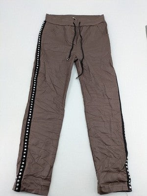 TREDY brown pants with black side stripes, silver studs, and adjustable drawstring.