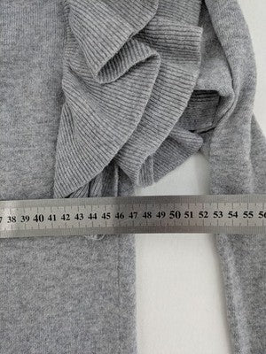 H&M grey cardigan with V-neck, button front, and layered ruffle sleeves.