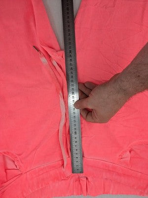 Pink Cherry pink jogpants with elastic waistband, decorative button placket, and rolled cuffs.