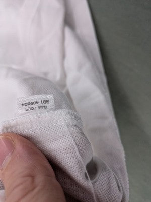 GANT white polo shirt with navy collar, embroidered logo on chest, piqué fabric.
