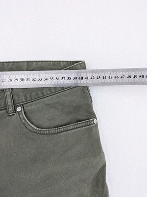 H&M khaki skinny fit jeans with classic five-pocket design and stretch cotton material.