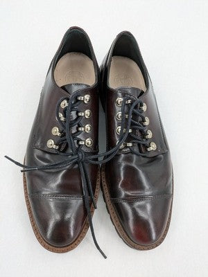 Massimo Dutti brown deck shoes glossy leather cap toe with metallic eyelets and rugged sole.