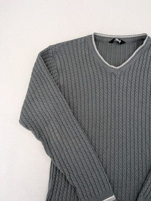 Elake grey knit jumper with V-neck, cable knit pattern and contrasting stripes.
