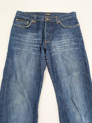 Dolce & Gabbana blue bootcut jeans with suede logo patch and classic 5-pocket design.