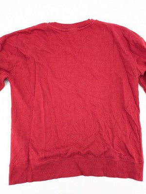 The Grinch red sweatshirt featuring large graphic of The Grinch in Santa suit