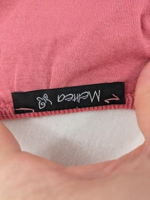 Melitea pink crop top with smocked waist and voluminous balloon sleeves.