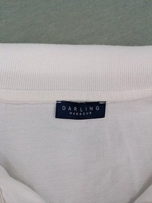 Darling Harbour white polo shirt with collar and three-button placket.