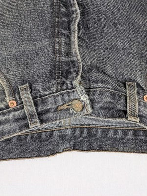 Levi's straight jeans faded black grey denim with iconic orange tab and five-pocket design.