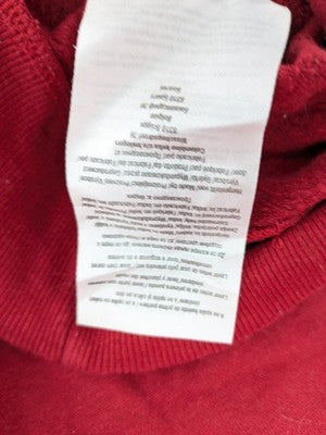 The Grinch red sweatshirt featuring large graphic of The Grinch in Santa suit