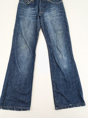 Dolce & Gabbana blue bootcut jeans with suede logo patch and classic 5-pocket design.