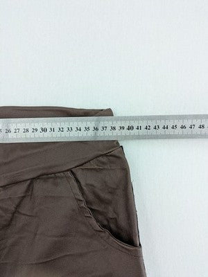 TREDY brown pants with black side stripes, silver studs, and adjustable drawstring.