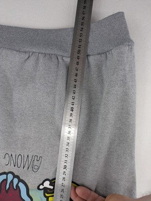 Among Us grey sweatshirt featuring colorful graphic of crew members and sleeve designs.