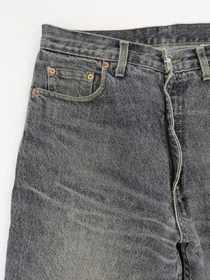 Levi's straight jeans faded black grey denim with iconic orange tab and five-pocket design.