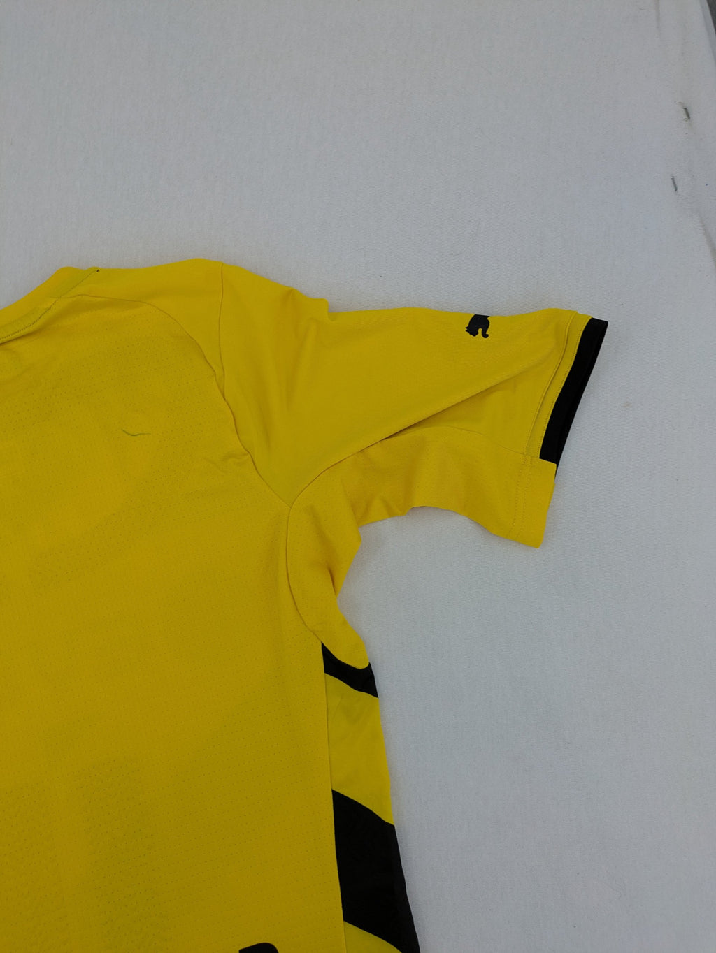 Puma black and yellow Borussia Dortmund soccer jersey with logo, stars, and sponsor print.