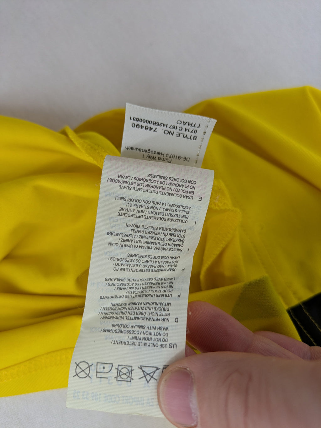 Puma black and yellow Borussia Dortmund soccer jersey with logo, stars, and sponsor print.