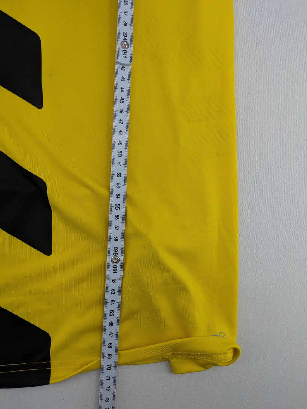 Puma black and yellow Borussia Dortmund soccer jersey with logo, stars, and sponsor print.