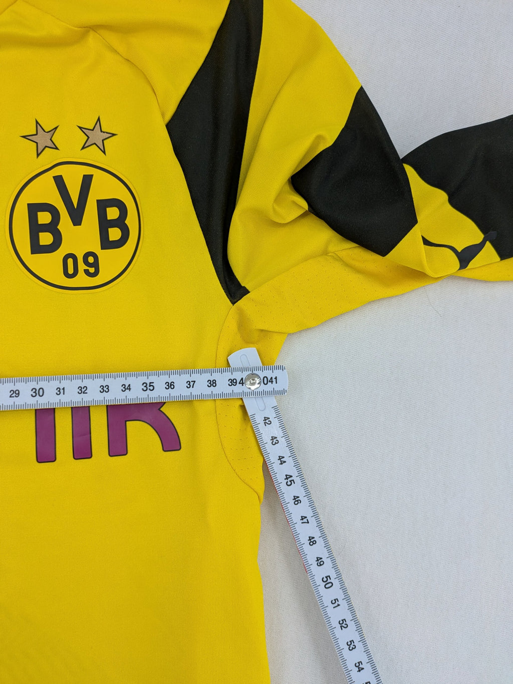 Puma black and yellow Borussia Dortmund soccer jersey with logo, stars, and sponsor print.
