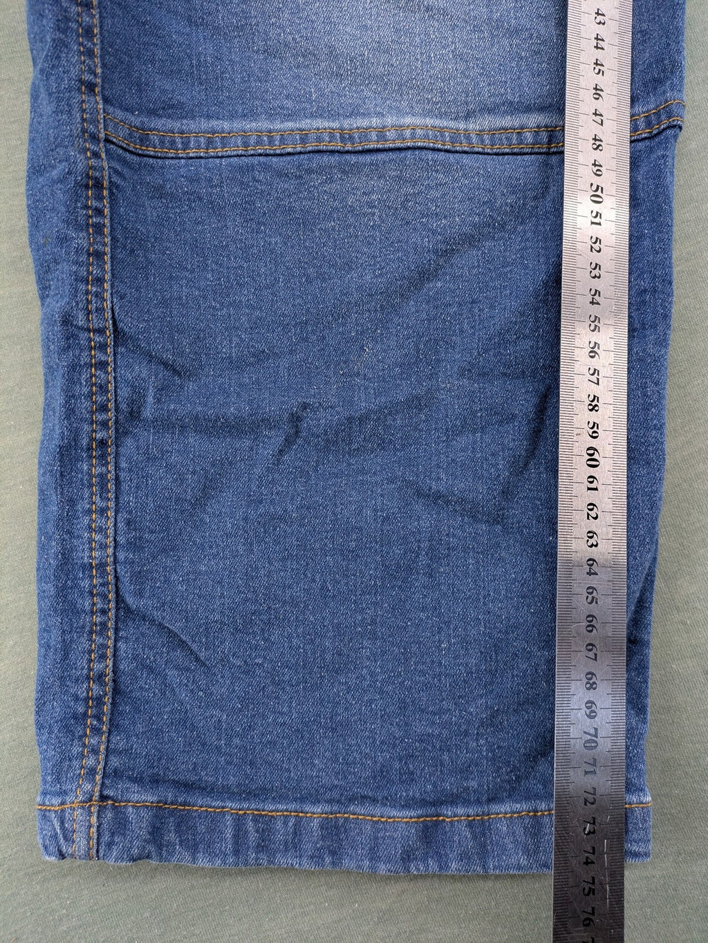 Bench blue straight jeans with reinforced knees and multiple cargo pockets.