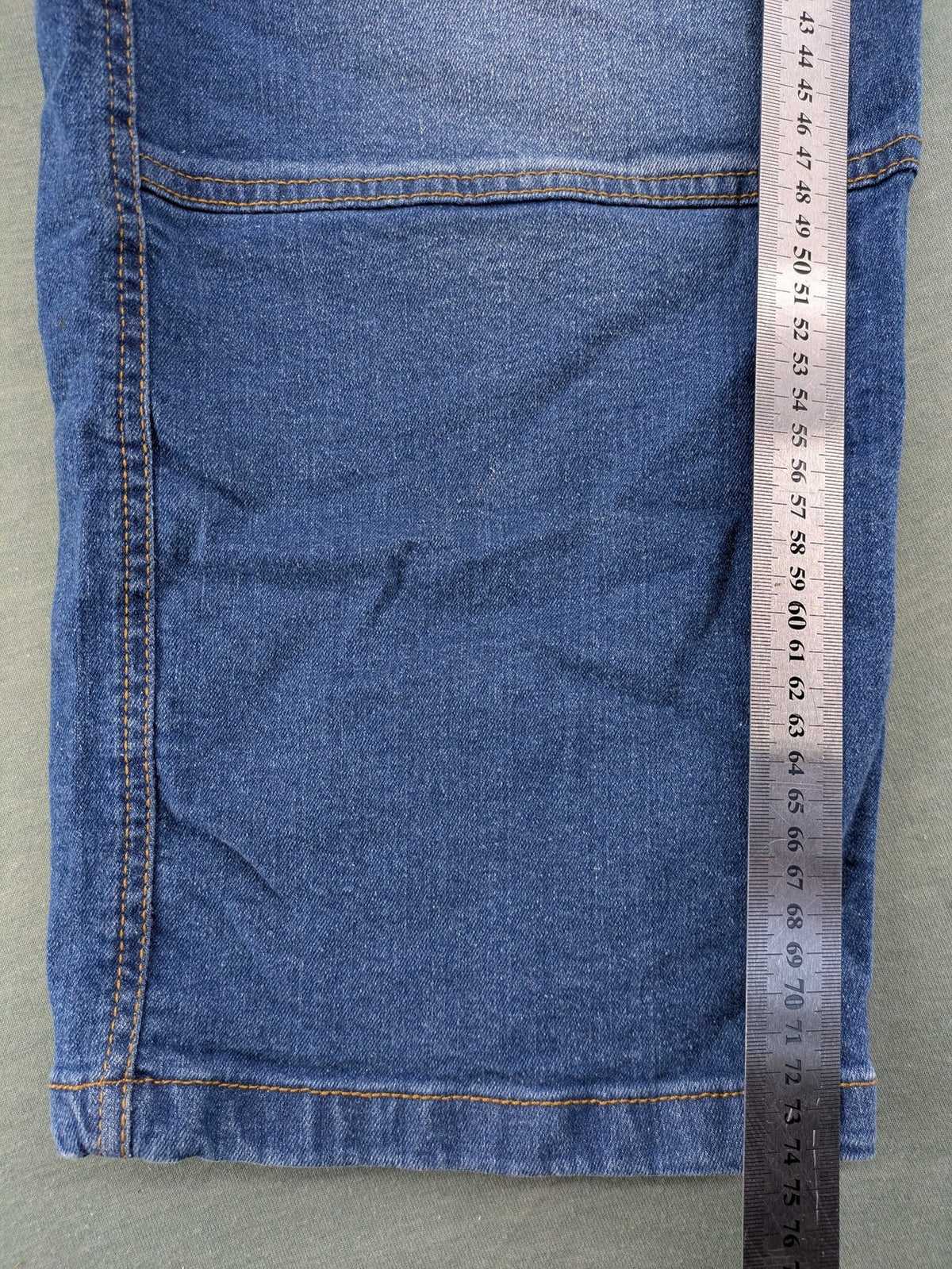 Bench blue straight jeans with reinforced knees and multiple cargo pockets.