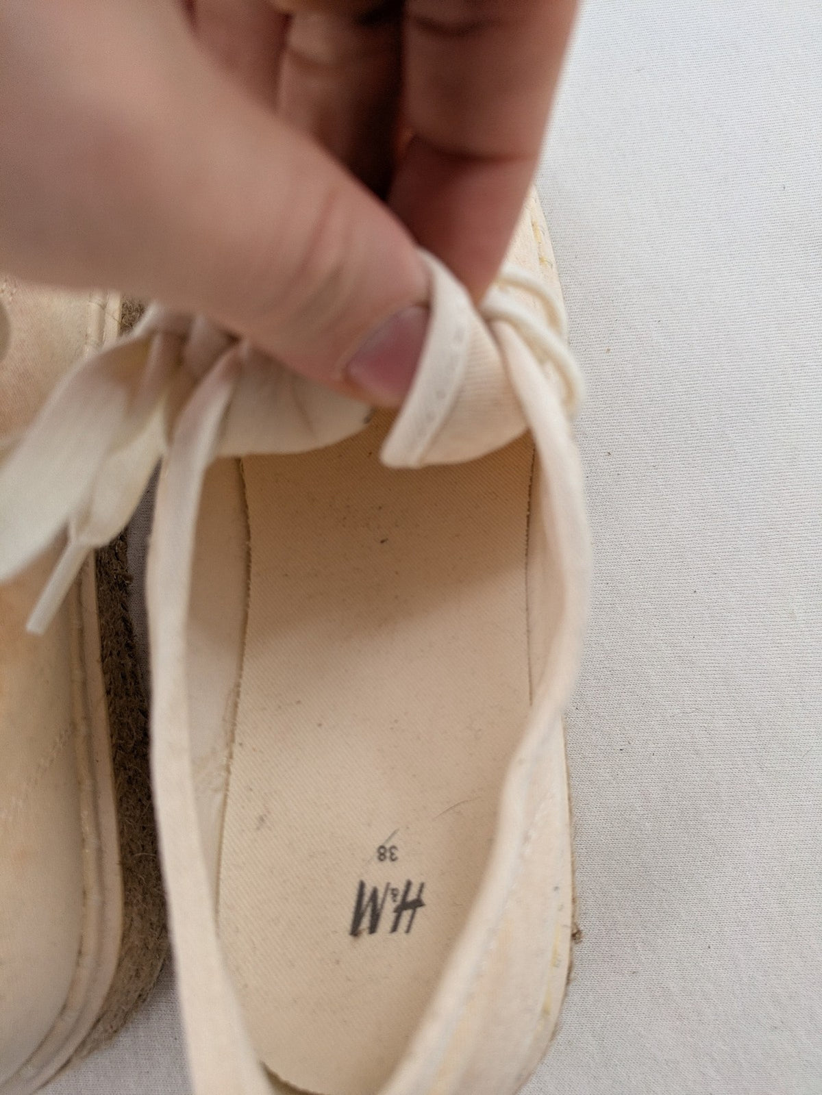 H&M beige espadrille sneakers with jute sole and cream canvas upper.