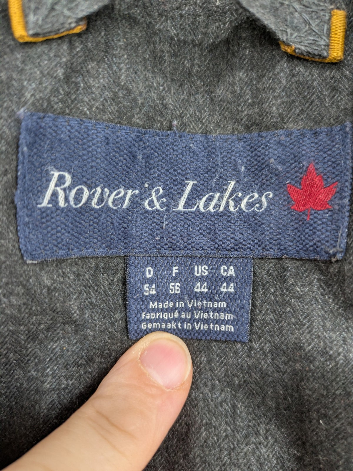 Rover & Lakes grey jacket with hood, quilted lining, and multiple pockets.