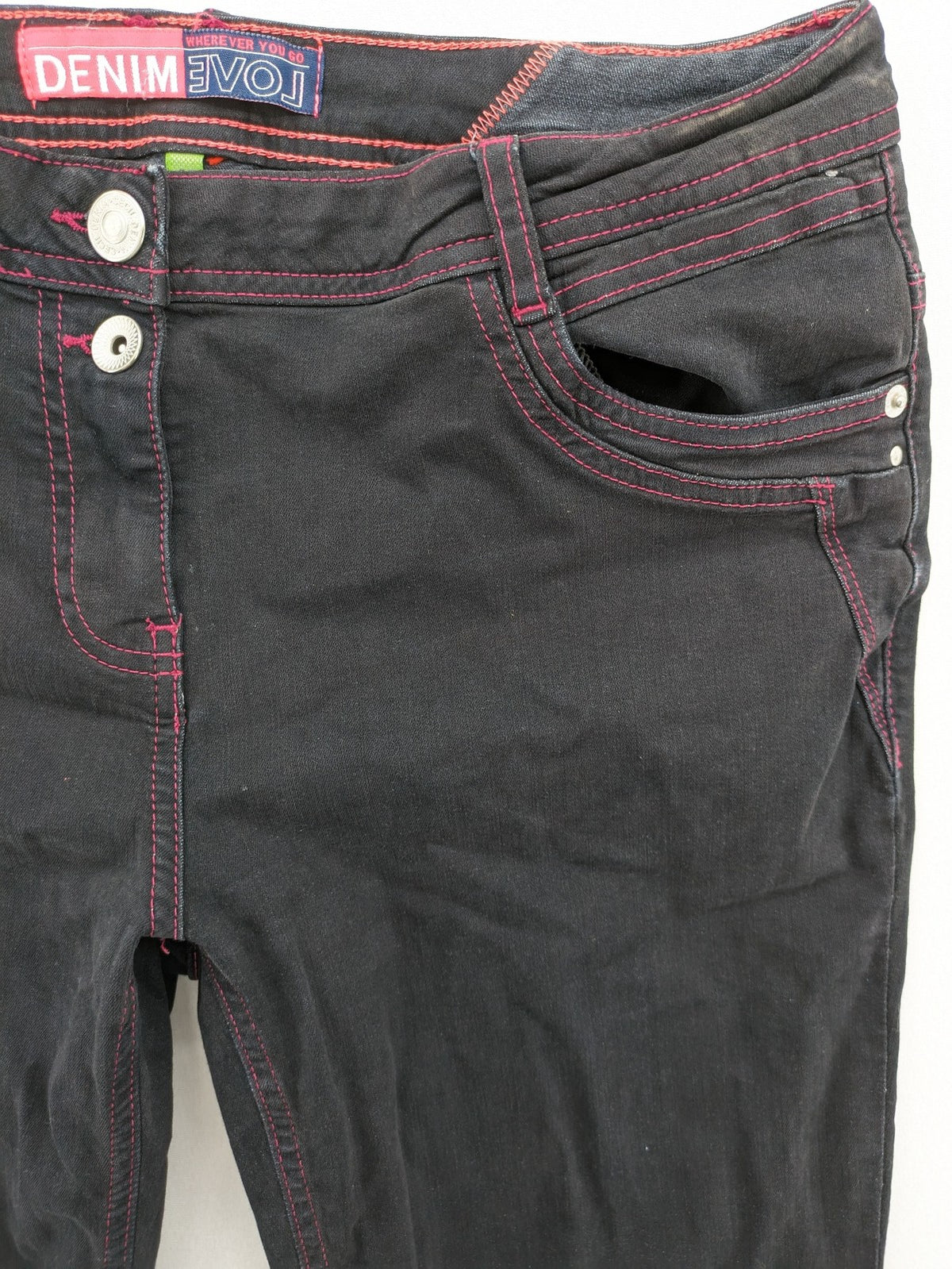 Denim black straight jeans with pink contrast stitching and classic 5-pocket style.