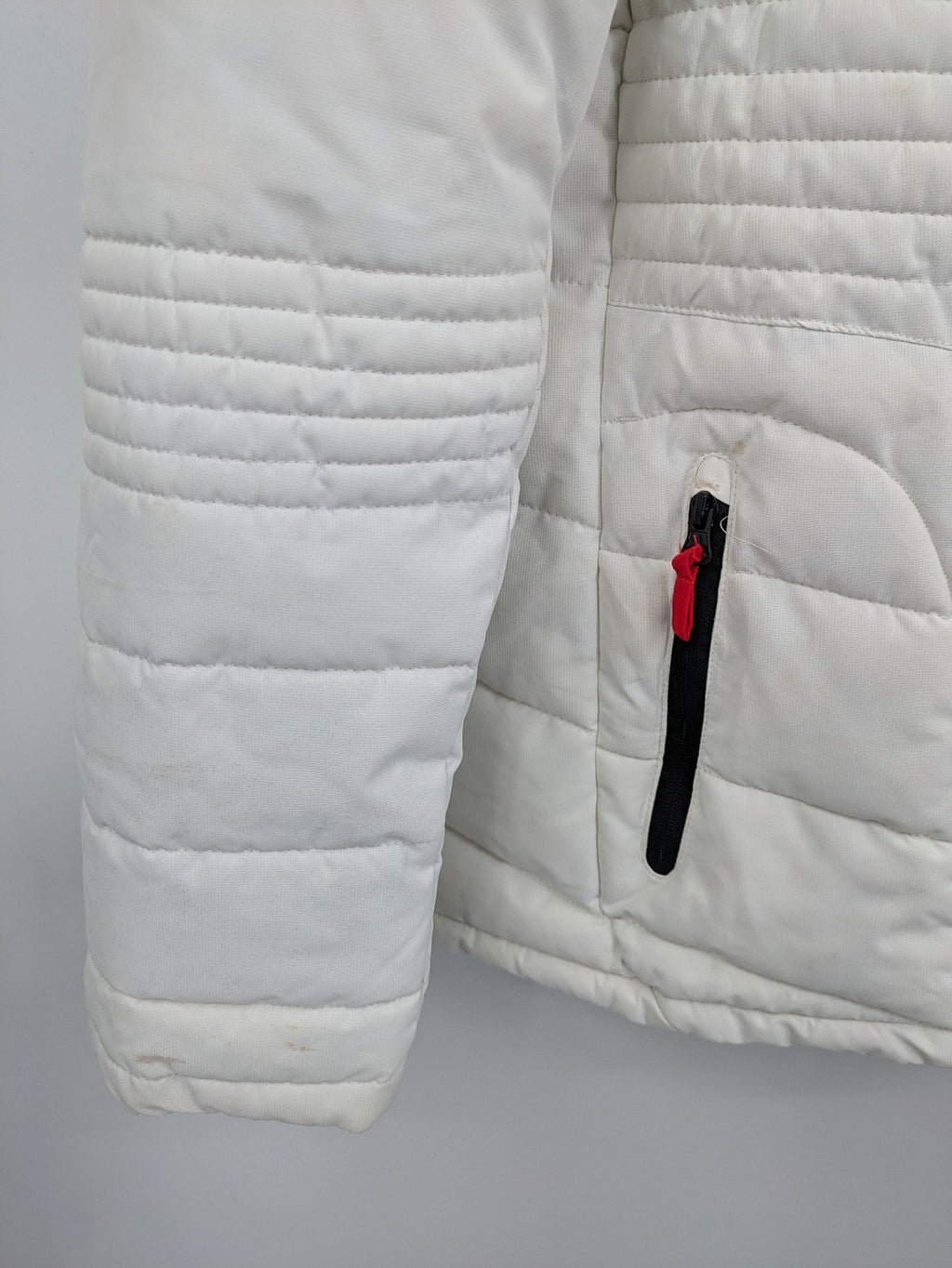Janina white puffer jacket with quilted design and faux fur hood accents.