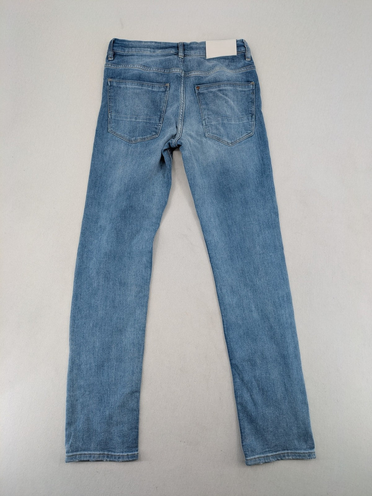 H&M blue skinny fit jeans, classic 5-pocket design, super stretch material.