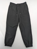 H&M black sweatpants with adjustable drawstring, elastic cuffs, and side pockets.