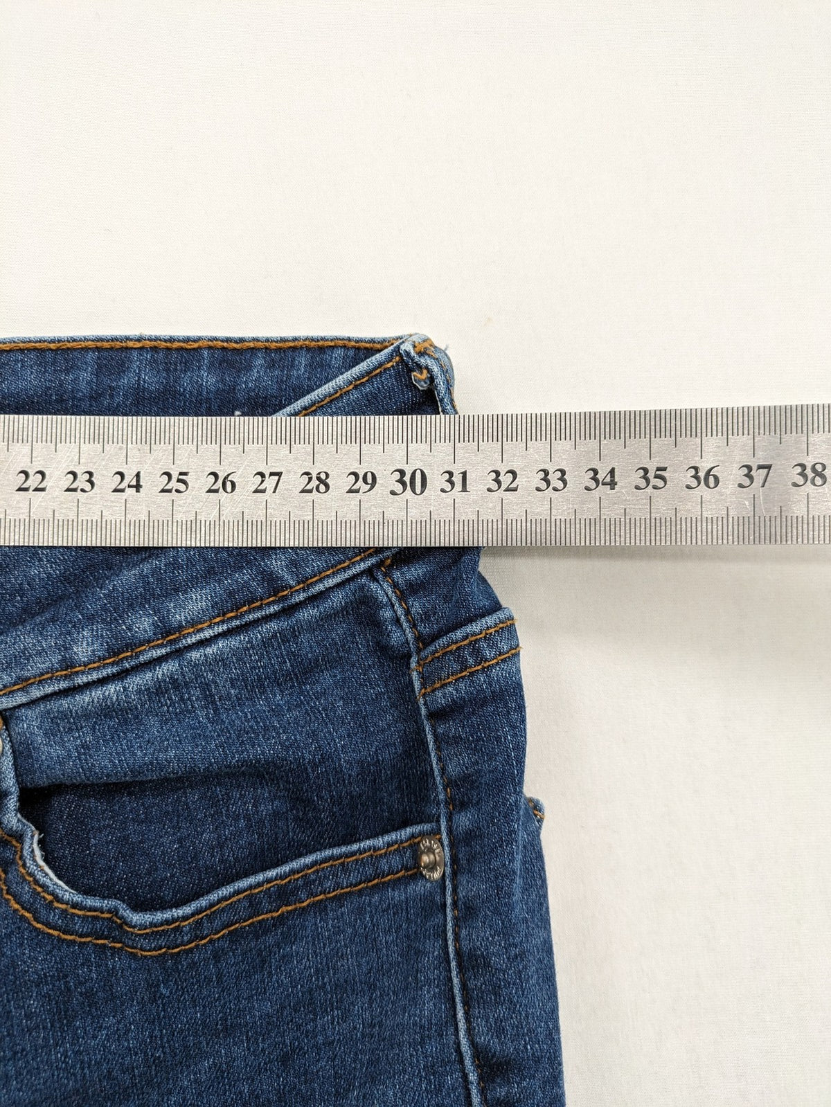 Pull&Bear blue flare jeans high waist with classic button closure and stylish silhouette.