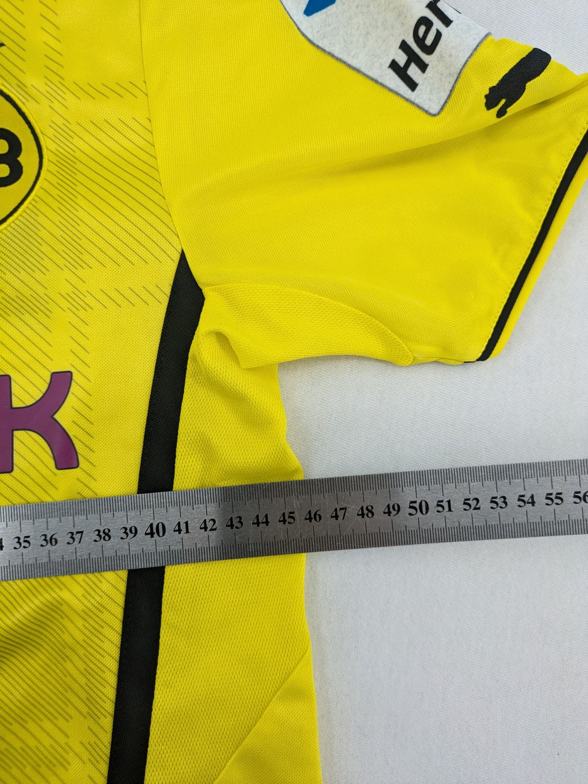 Borussia Dortmund black and yellow soccer uniform with DFB Pokal 2014 patch and Puma logo.