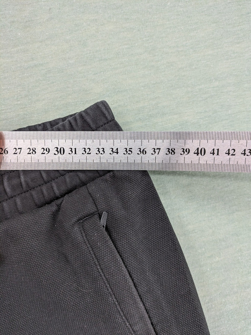 Puma grey sweatshorts featuring Mercedes AMG Petronas logo and elastic waistband.
